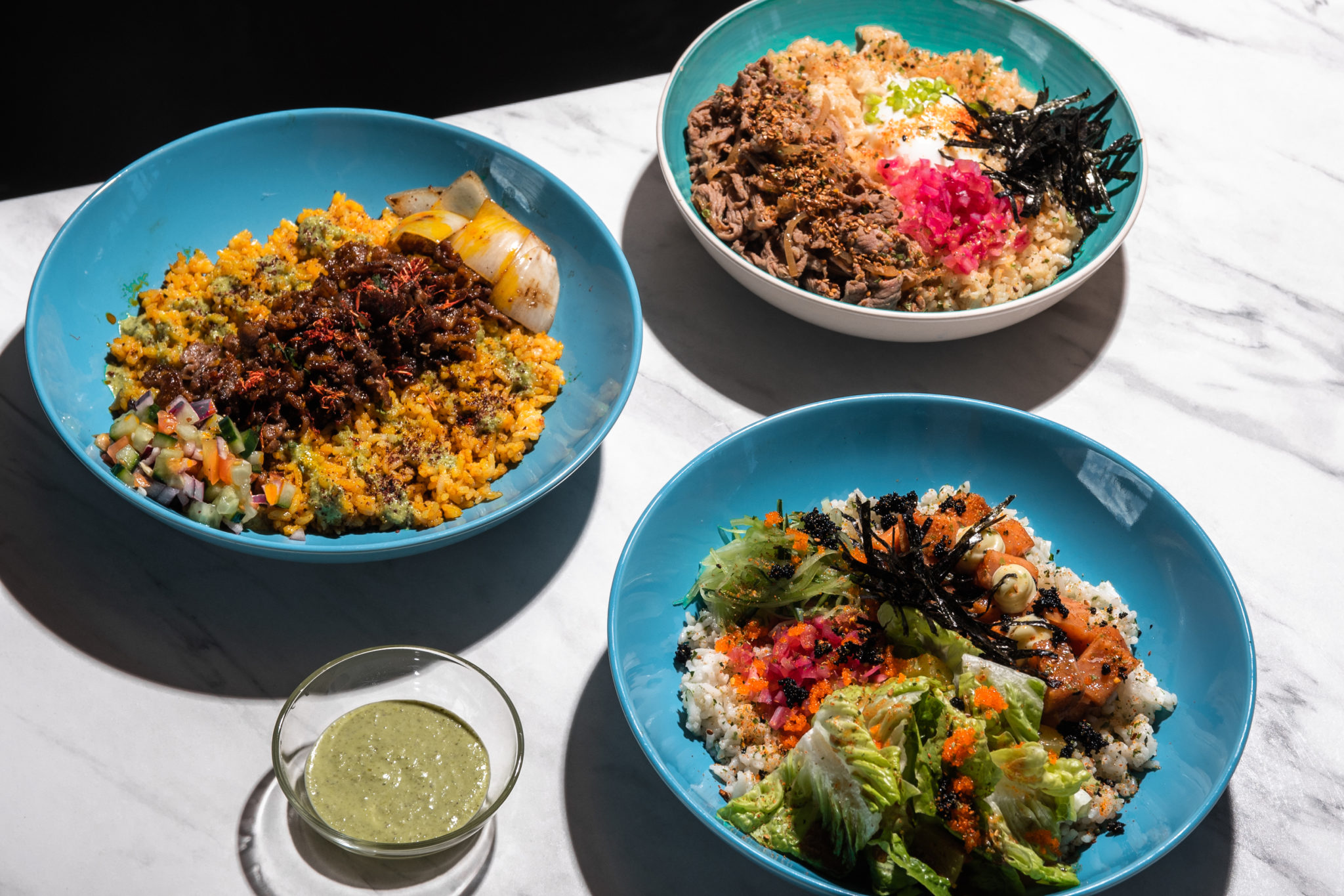Shawarma rice, beef gyudon, and spicy salmon poke bowl from Tipple & Slaw