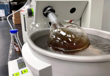 A whiskey sample made by Bespoken Spirits spins in a beaker during a process designed to remove chemical compounds from the liquid at the company's lab in Menlo Park, California