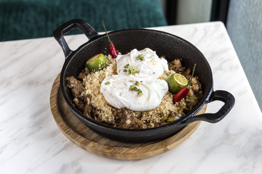 Esmeralda sisig: Savory, crisp, and decadent chopped pork mask with egg