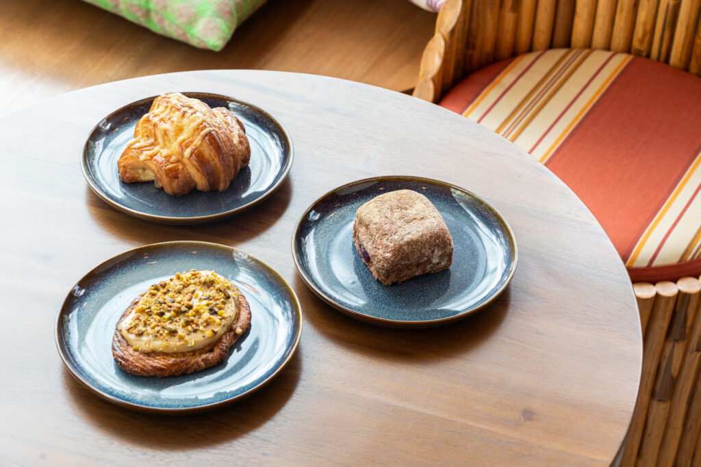 Glazed ham and cheese croissant, pistachio danish, and ube halaya white chocolate