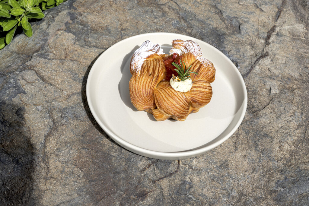 In season pink guava turned into a jam with passionfruit on a croissant wreath. On top is a homemade Boursin cheese and rosemary