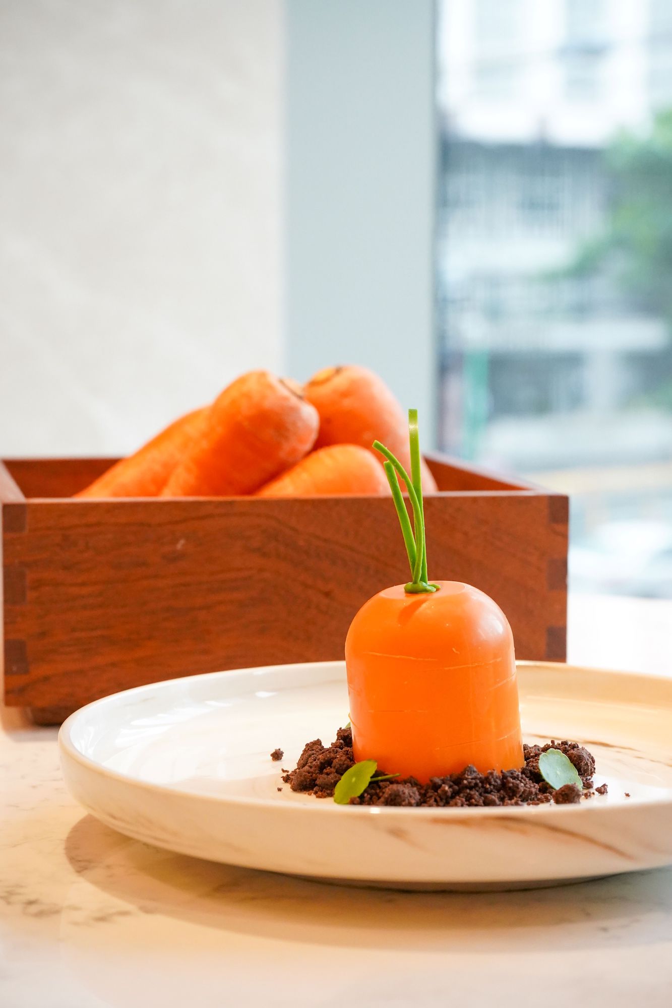 Plant-based Carrot Cake (Egg-less carrot sponge, whipped coconut-lime frost, cocoa soil crumble)